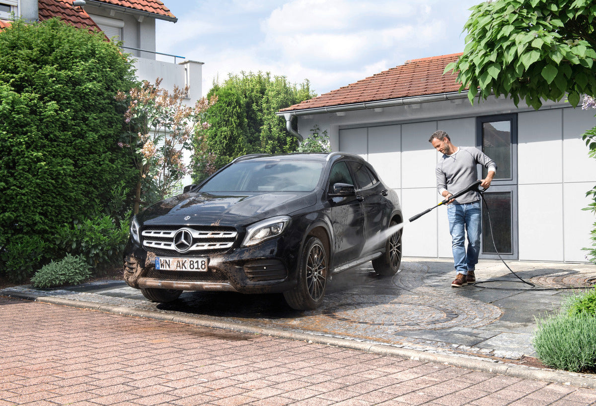 Image of man washing a mercedes GLA car with Karcher High Pressure washer