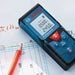 Bosch GLM 40 Laser Distance Measurement Tape with readings shown on the screen